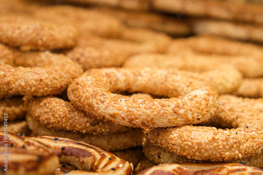 Close up pastry rings with sesame consumed in holy days. Kandil simidi is at native language. Selective focus of pastry rings. 
