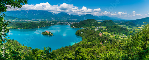 A panorama view from the Mala Osojnica viewpoint over Lake Bled and the surrounding countryside in Slovenia in summertime © Nicola