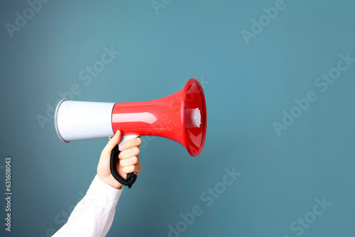 Hand with megaphone. Sharing news, avertising, promotion,announcement concept