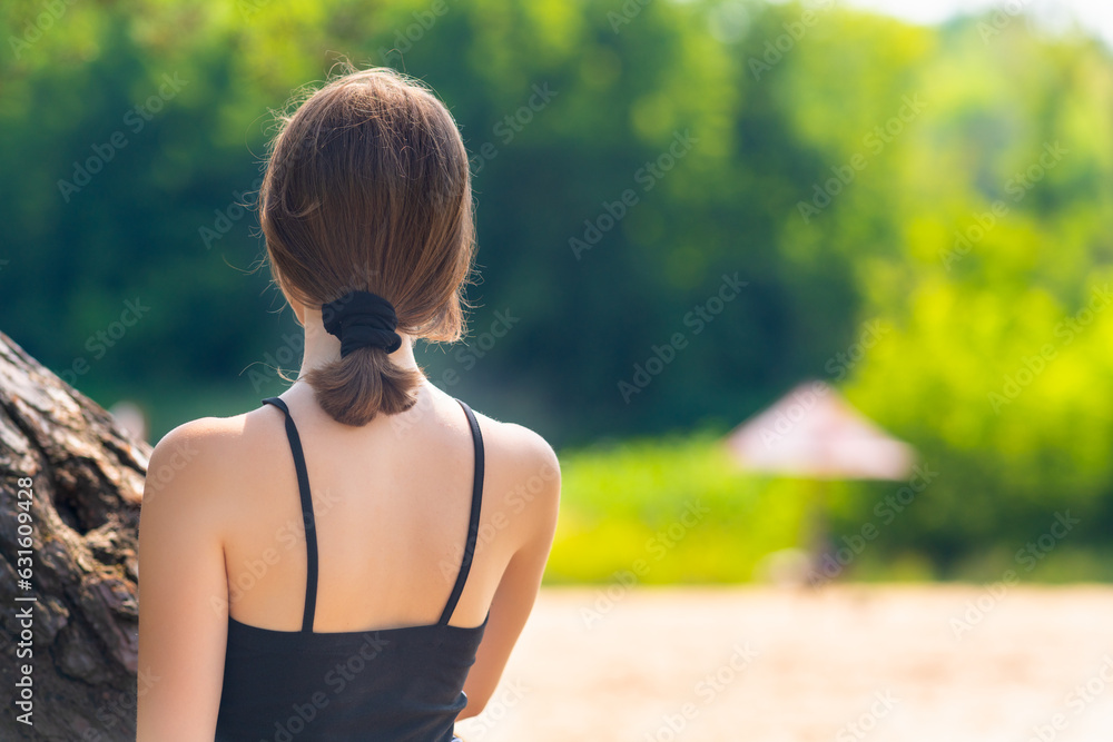 Rear view of a girl looking forward