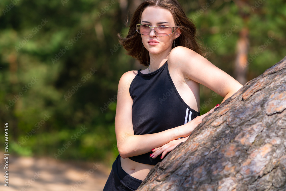 Girl in sportswear and sunglasses