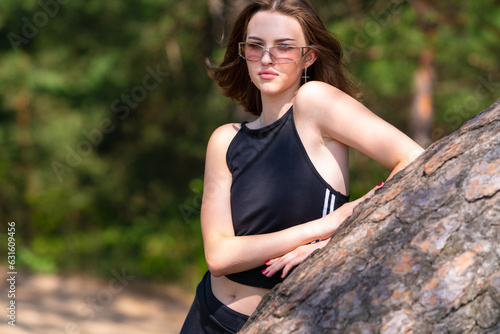 Girl in sportswear and sunglasses