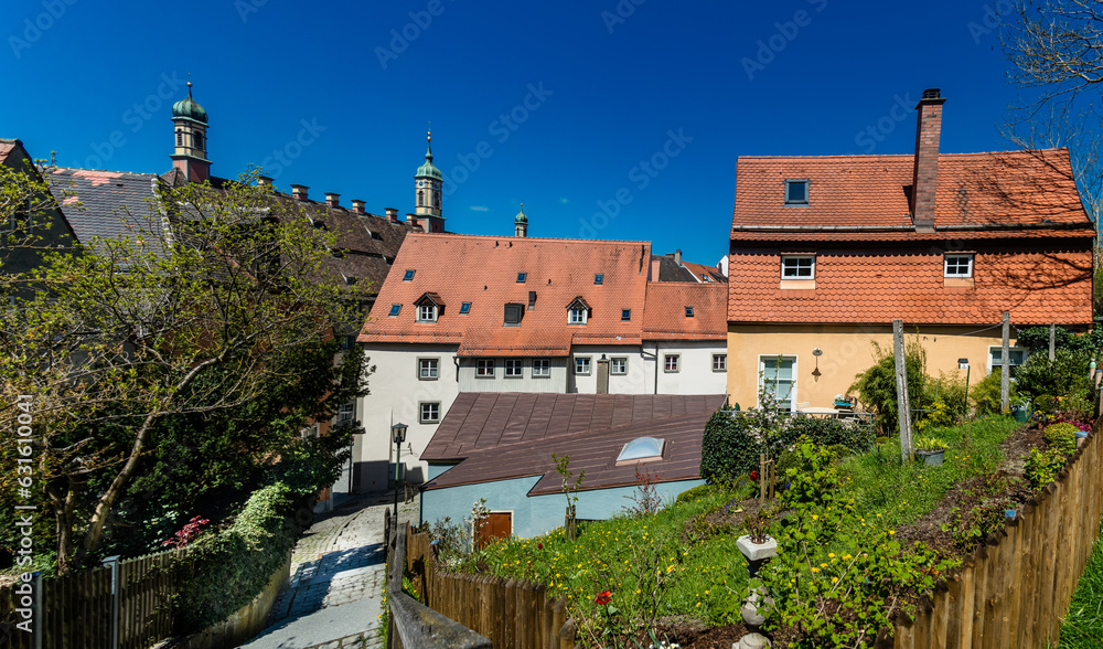 Buildings in a town viewed from an elevated path Buildings in a town viewed from an elevated path