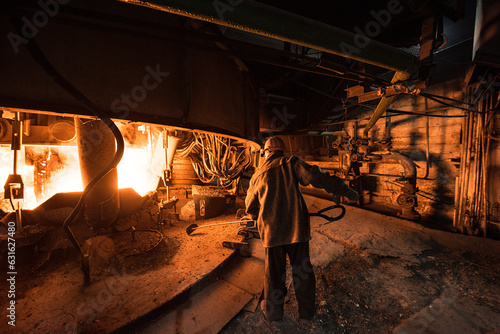 Steelworker at work near the arc furnace