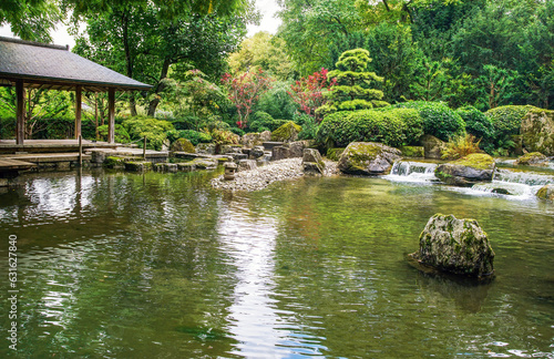 Foto Awe view on japanese garden in Hamburg with palmate maple and palmate maple diss
