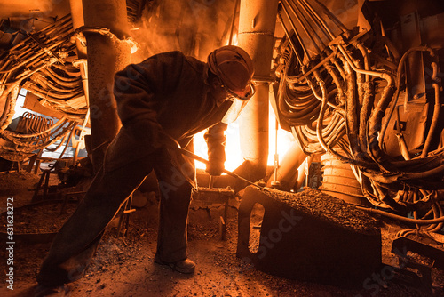 Photographie Steelworker at work near the arc furnace