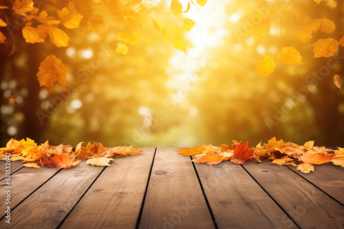 Autumn background with wooden table and colored fall leaves. Composition with copy space