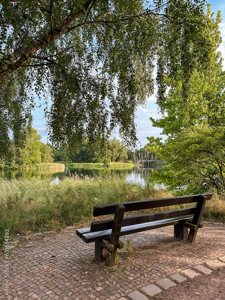 Bench by the lake in Britzer garden
