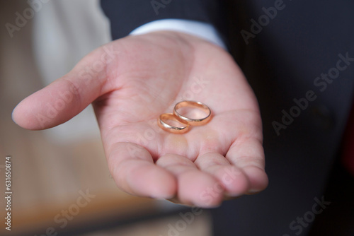 wedding rings in hand