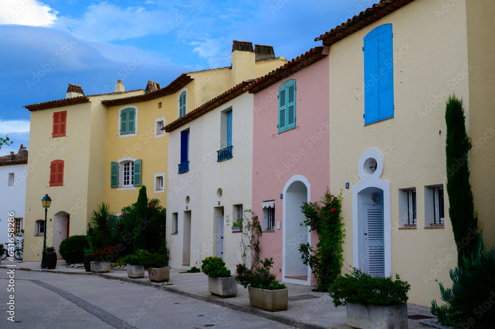 Colorful houses in Port Grimaud, village on Mediterranean sea with yacht harbour, Provence, summer vacation France