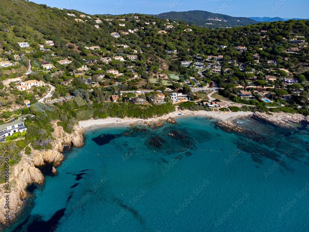Summer holidays on French Riviera, aerial view on rocks and sandy beach Escalet with crystal clear blue water near Ramatuelle and Saint-Tropez, France