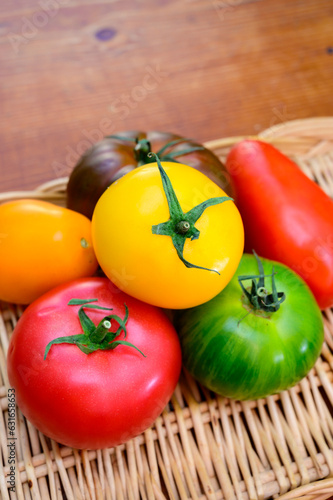 Variety of colorful tasty ripe french tomatoes on farmers market in Provence in summer close up photo