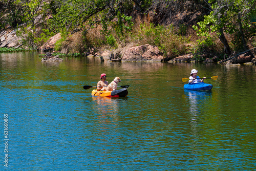 Kayakers With Yellow Lab Near Devils Waterhole at Inks Lake State Park, Burnet, Texas, USA