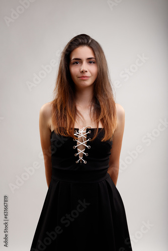 Young woman in black dress; loves medieval cosplay