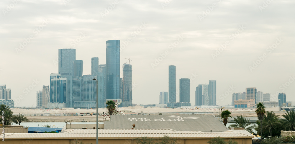 View from the window of a tourist bus on the architecture of the city of Abu Dhabi, United Arab Emirates