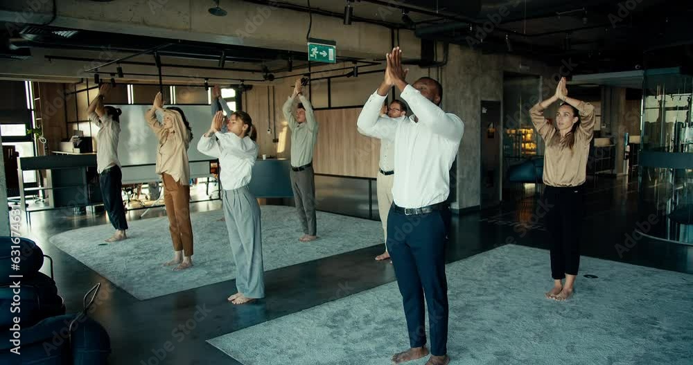 The practice of calmness and meditation for business people in the office. Break at work for group meditation in an international team The practice of calmness and meditation for business people in the office. Break at work for group meditation in an international team