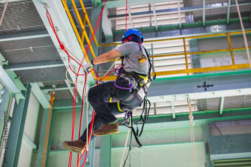 Male worker training rope access photo