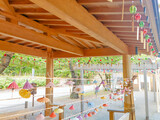 Colorful wind chimes hanging under the eaves of a shrine