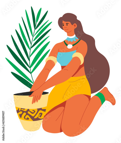 Woman planting exotic foliage florist composition