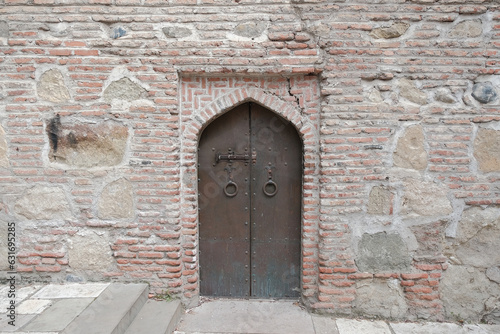 Wallpaper Mural Wrought iron door. metal door in an old medieval temple. medieval background Torontodigital.ca