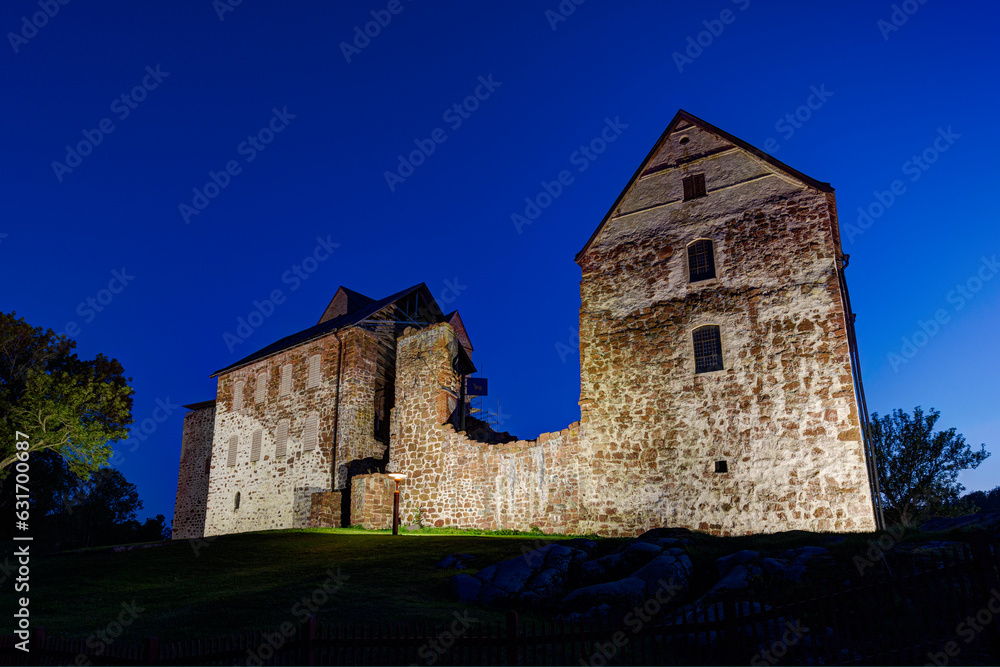 Lit medieval Kastelholm Castle in Åland Islands, Finland, at dusk in the summer. Lit medieval Kastelholm Castle in Åland Islands, Finland, at dusk in the summer.