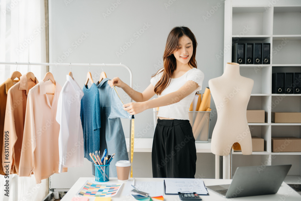 Young woman running online store Startup small business SME, using smartphone or tablet taking receive and checking online purchase shopping order.. Young woman running online store Startup small business SME, using smartphone or tablet taking receive and checking online purchase shopping order..