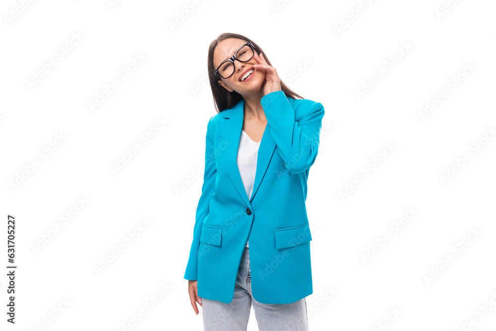 young brunette woman secretary in a blue elegant jacket on a white background with copy space