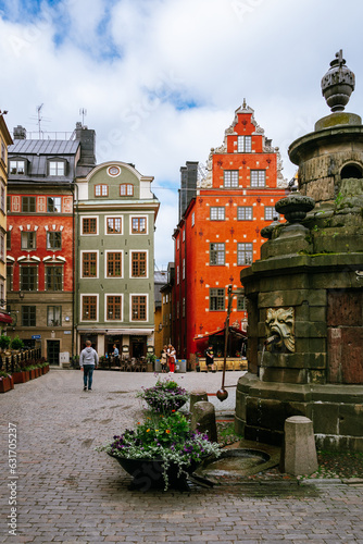 Stockholm Old town square (Stortorget) with colorful buildings and historic fountain