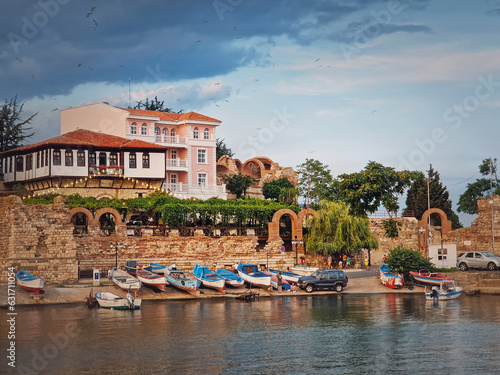 The old town of Nessebar, UNESCO world heritage on the Black Sea coastline, Burgas Region, Bulgaria. Sightseeing view with a mixture of ancient ruins and modern hotel resort on the coast photo