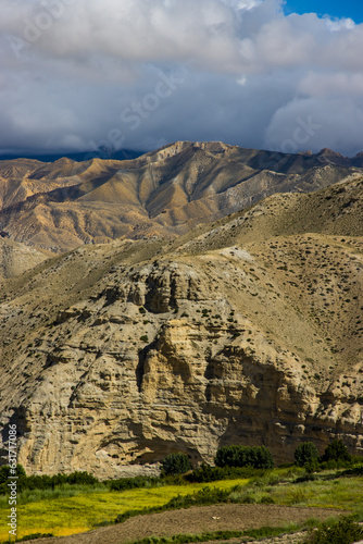 Beautiful and Dramatic Tibetan Landscape with Farmalnd in Ghiling Village of Upper Mustang in Nepal photo