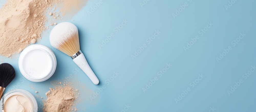 a flat lay of skin care products including a face massage brush, hyaluronic acid, cream for the face, and a clay mask. The background is blue and empty space for text or copy. It represents skin a flat lay of skin care products including a face massage brush, hyaluronic acid, cream for the face, and a clay mask. The background is blue and empty space for text or copy. It represents skin