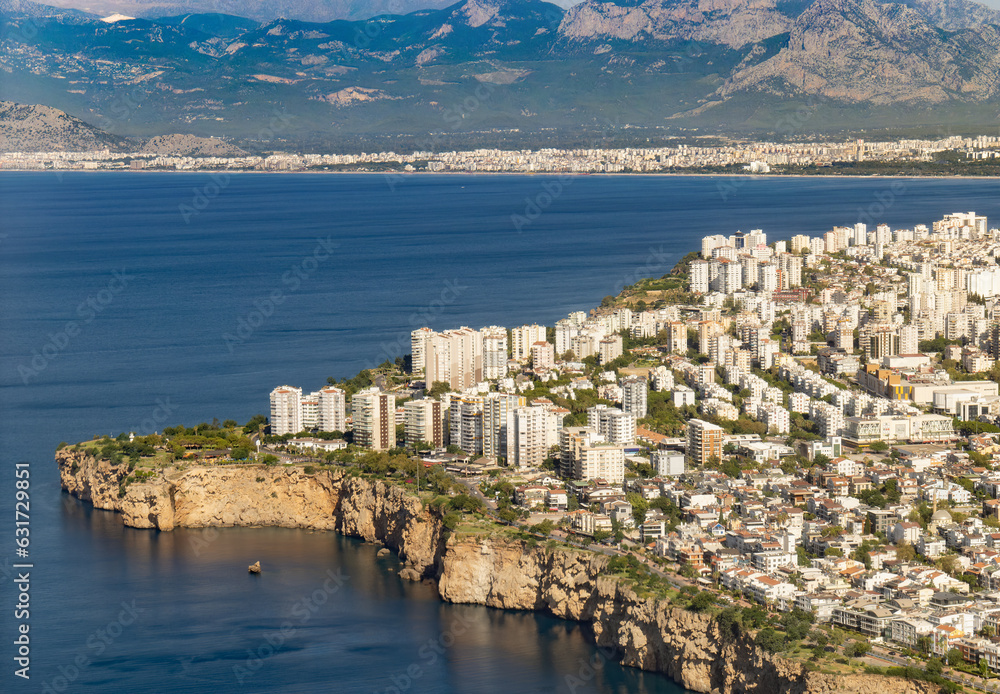Fototapeta premium Aerial view of Antalya and Falezler.. Coast, buildings, sea and the engine from the airplane window. Travel to Turkey concept. 