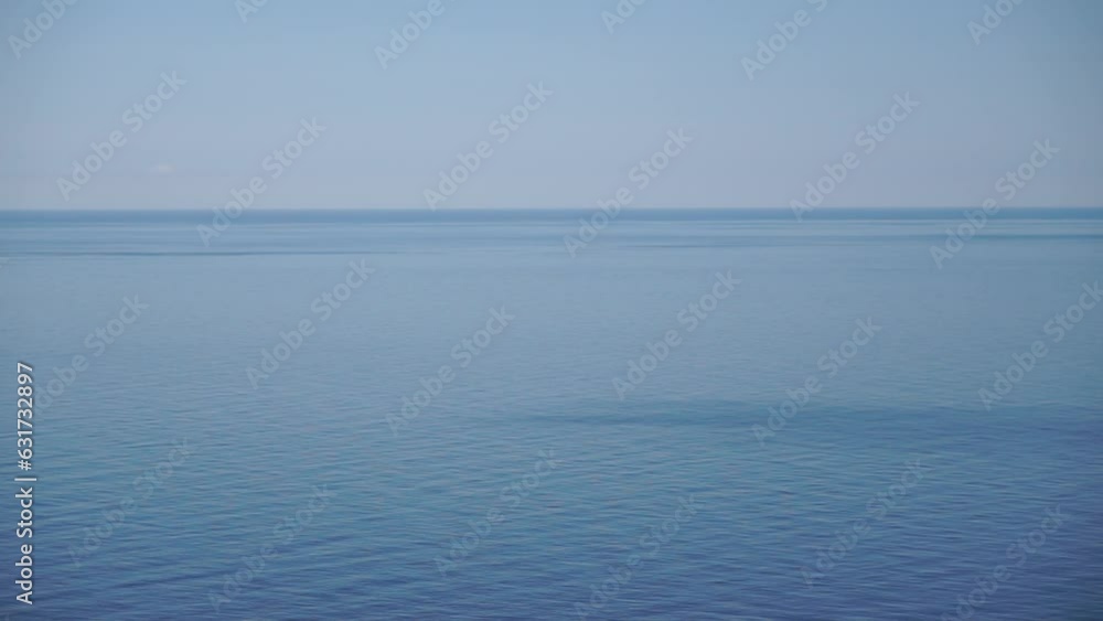 Aerial panoramic view of beautiful sunset above sea. Beautiful seascape. Sun glare, small waves on the water surface. Evening. Horizon. Nobody. No people. Never-ending beauty of nature. Aerial panoramic view of beautiful sunset above sea. Beautiful seascape. Sun glare, small waves on the water surface. Evening. Horizon. Nobody. No people. Never-ending beauty of nature.