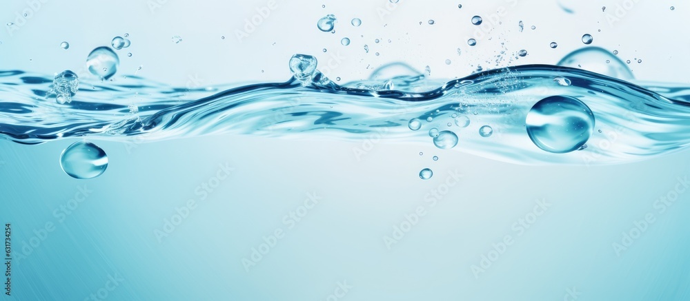 The water panoramic banner background is a flat lay image of water texture with rings and ripples. It is a spa concept background with copy space for composition. The water panoramic banner background is a flat lay image of water texture with rings and ripples. It is a spa concept background with copy space for composition.