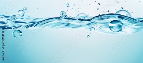 The water panoramic banner background is a flat lay image of water texture with rings and ripples. It is a spa concept background with copy space for composition.