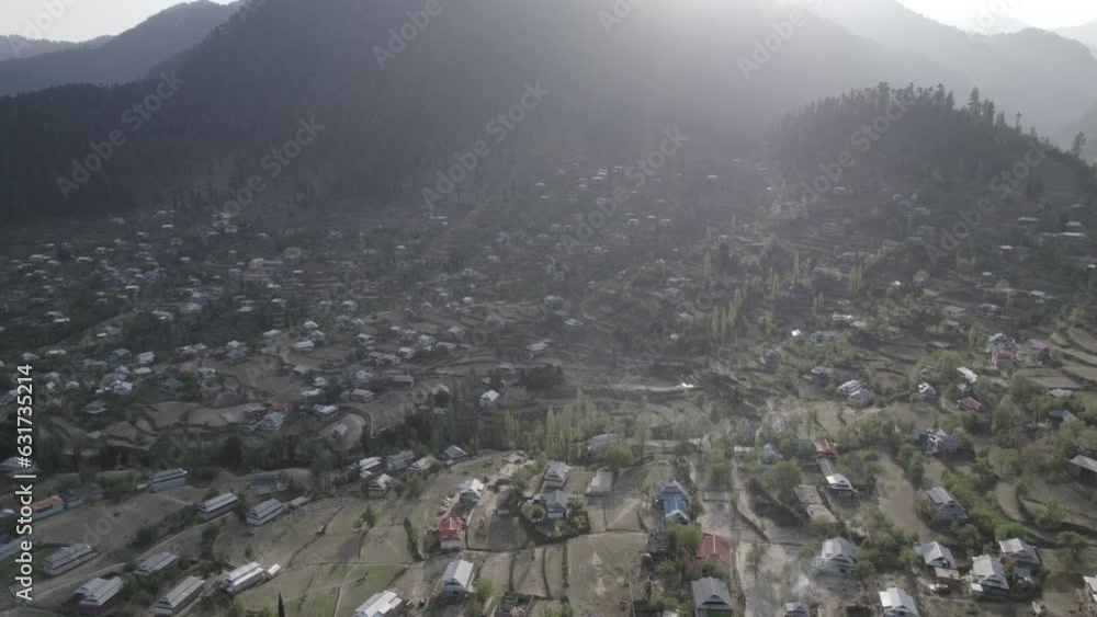 Drone Shot of A Village in Mountains and Forest in D-log 4k Drone Shot of A Village in Mountains and Forest in D-log 4k