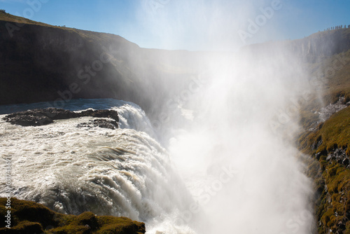 Gullfoss iconic waterfall known for its multi-step cascade along a 90° bend of the Hvitá River.