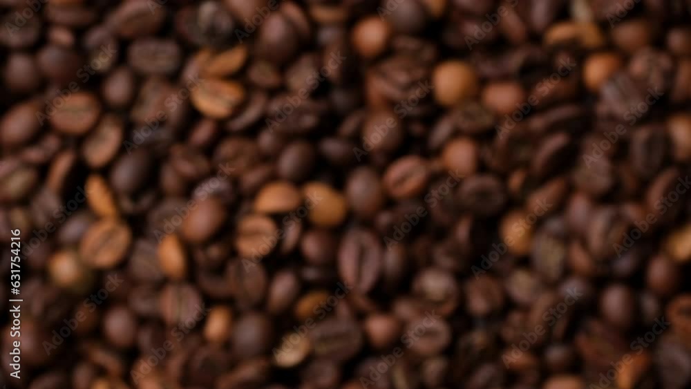 Zoom Dark roast coffee beans top view, rotate. Blurred and defocused effect Zoom Dark roast coffee beans top view, rotate. Blurred and defocused effect