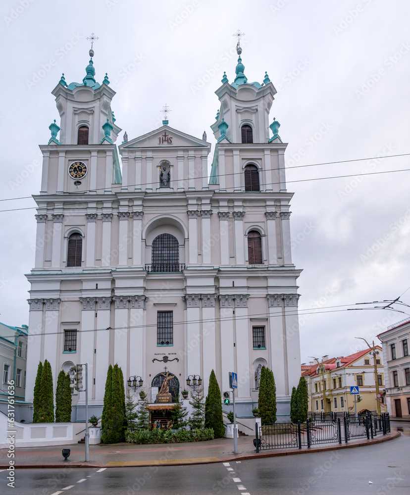 Cathedral of St. Francis Xavier in Grodno, Belarus. The period of the Christmas holidays. There is a nativity scene in front of the cathedral. Winter cloudy day