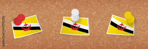 Brunei flag pinned in cork board, three versions of Brunei flag.