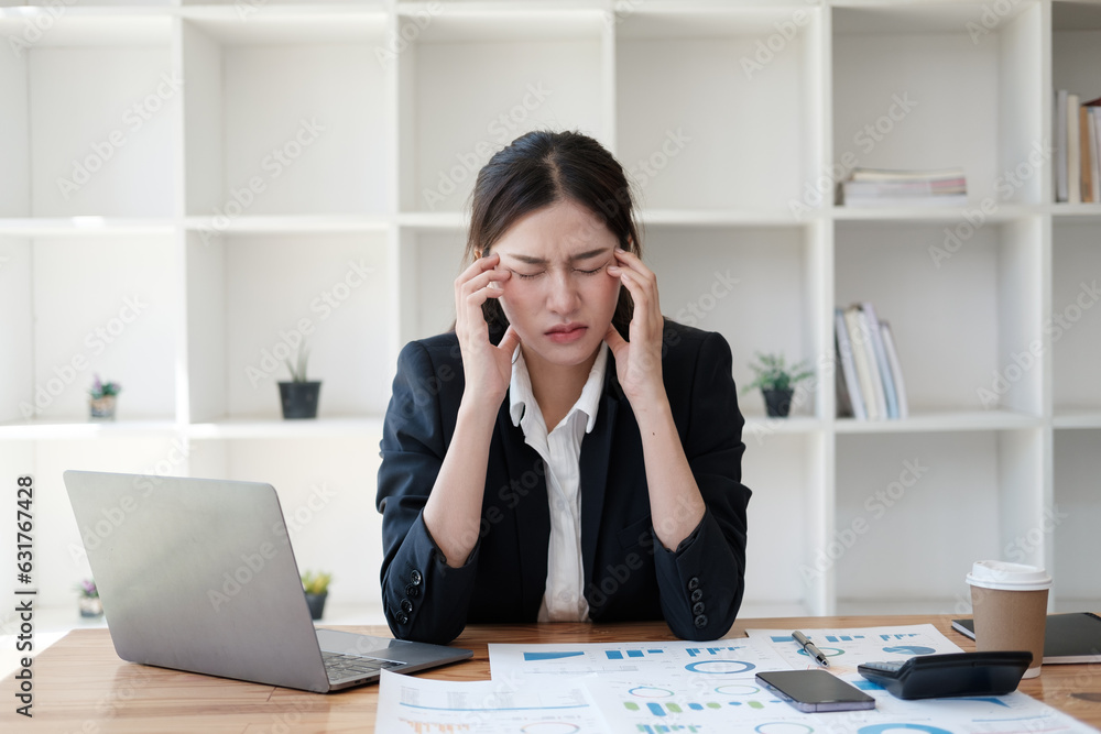 Tired and upset young businesswoman feeling exhausted from working in the office too long. Tired and upset young businesswoman feeling exhausted from working in the office too long.
