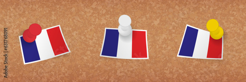 France flag pinned in cork board, three versions of France flag.