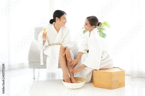 Spa body treatment for beauty and aroma therapy product for female feet and hand spa relax and healthy care, Masseur doing massage with treatment sugar scrub. Thailand. Healthy and Relax Concept