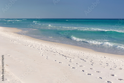 Sand and waves at Henderson Beach State Park, located along the Emerald Coast in Destin, Florida photo