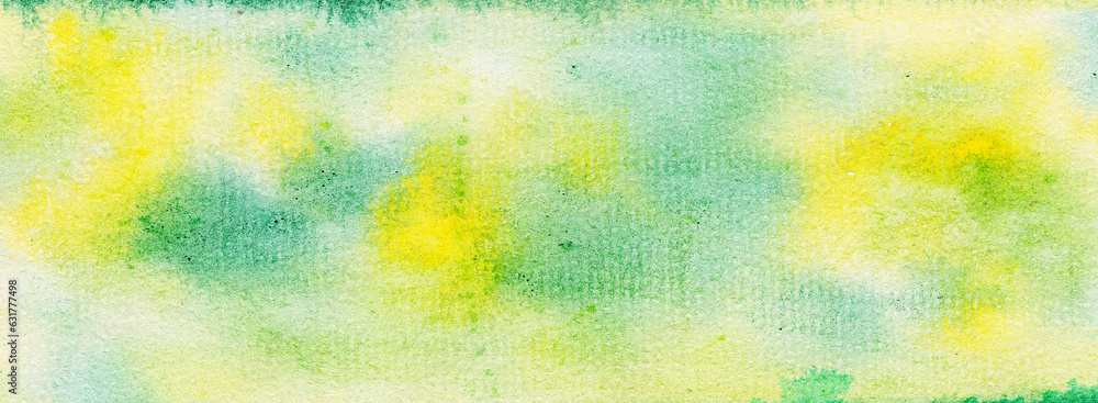 Abstract watercolor background, yellow and green spots of spread paint. Large beautiful banner.