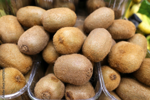 close up of organic and fresh kiwi fruits in the supermarket
