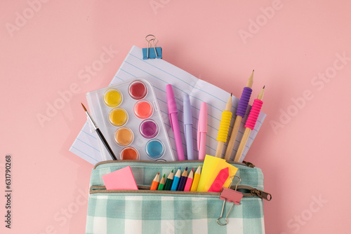 Fotografía Stylish stationery for school and office in a pencil case on a pink background