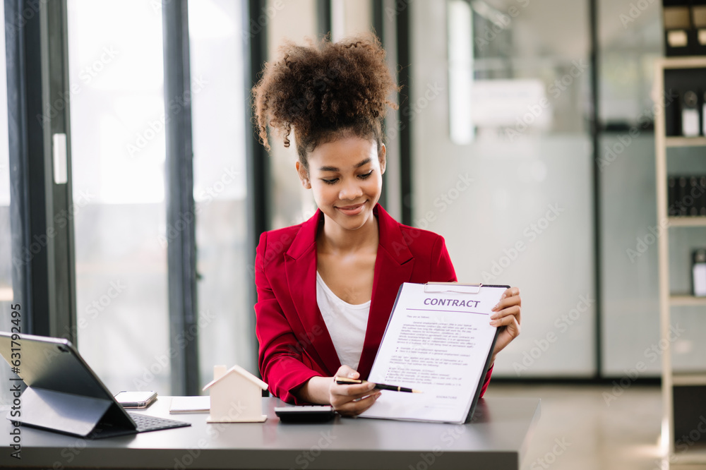 Signed the house buy a contract with the house sales agents. Buy or sell home concept. Happy in marketing signing contract of house . Signed the house buy a contract with the house sales agents. Buy or sell home concept. Happy in marketing signing contract of house .