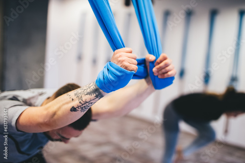 People practicing aerial yoga workout