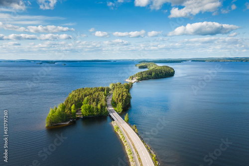 Aerial view of Pulkkilanharju Ridge, Paijanne National Park, southern part of Lake Paijanne. Blue lakes and a winding road from above photo